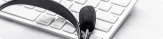 A headset resting on a computer keyboard