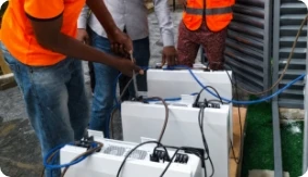 Installation team commissioning the battery system