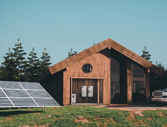 Remote cabin with solar panels and wall-mounted energy storage