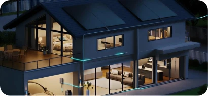Modern solar-powered home illuminated at night