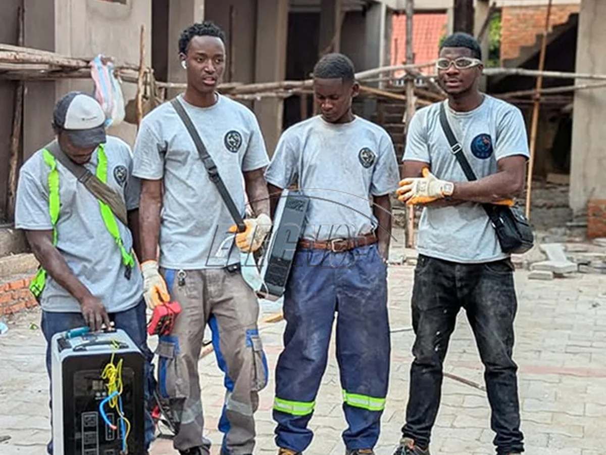 Burundi customer and installer team with the portable all-in-one storage system