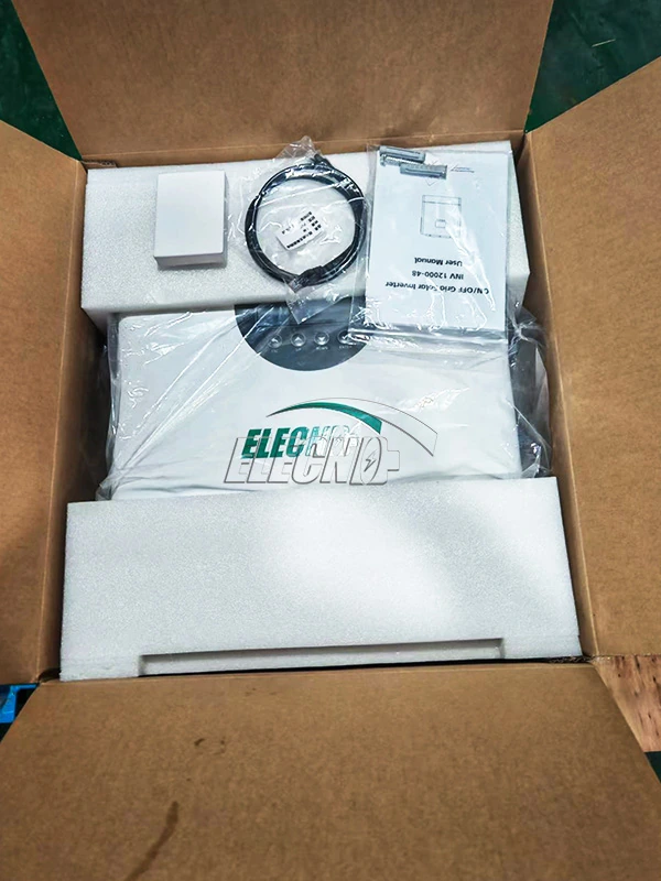 Solar inverter inside its carton with foam inserts, a cable and user manual