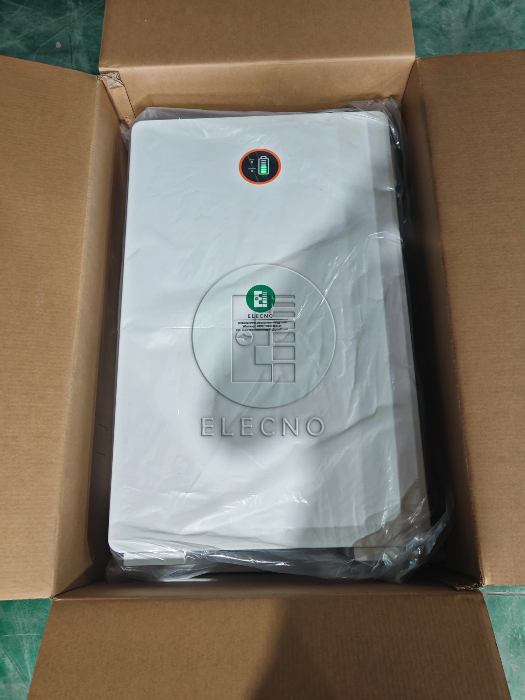 Battery enclosure in a protective bag inside an individual open carton