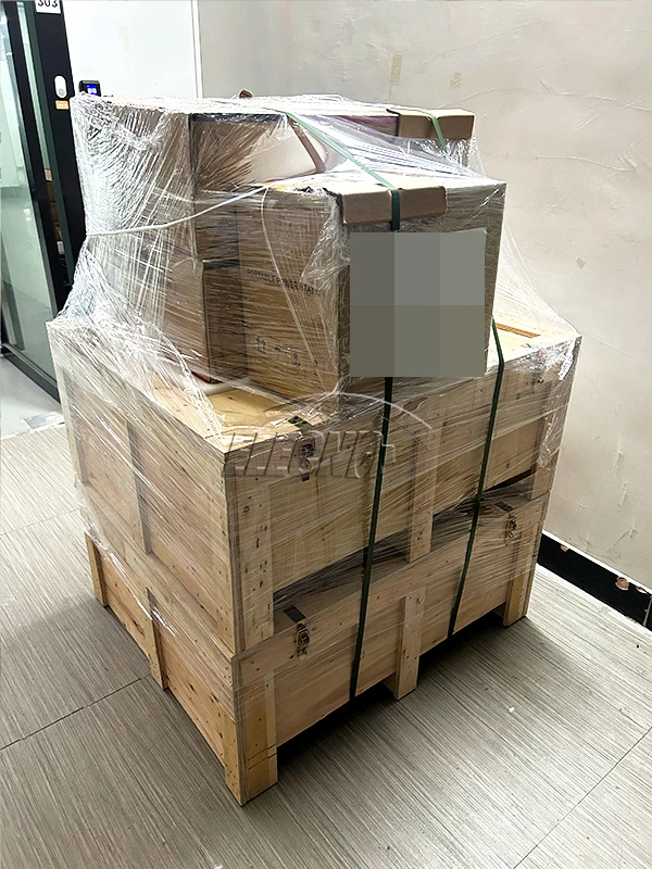 Side view of the wooden crate and cartons with customer shipping label obscured