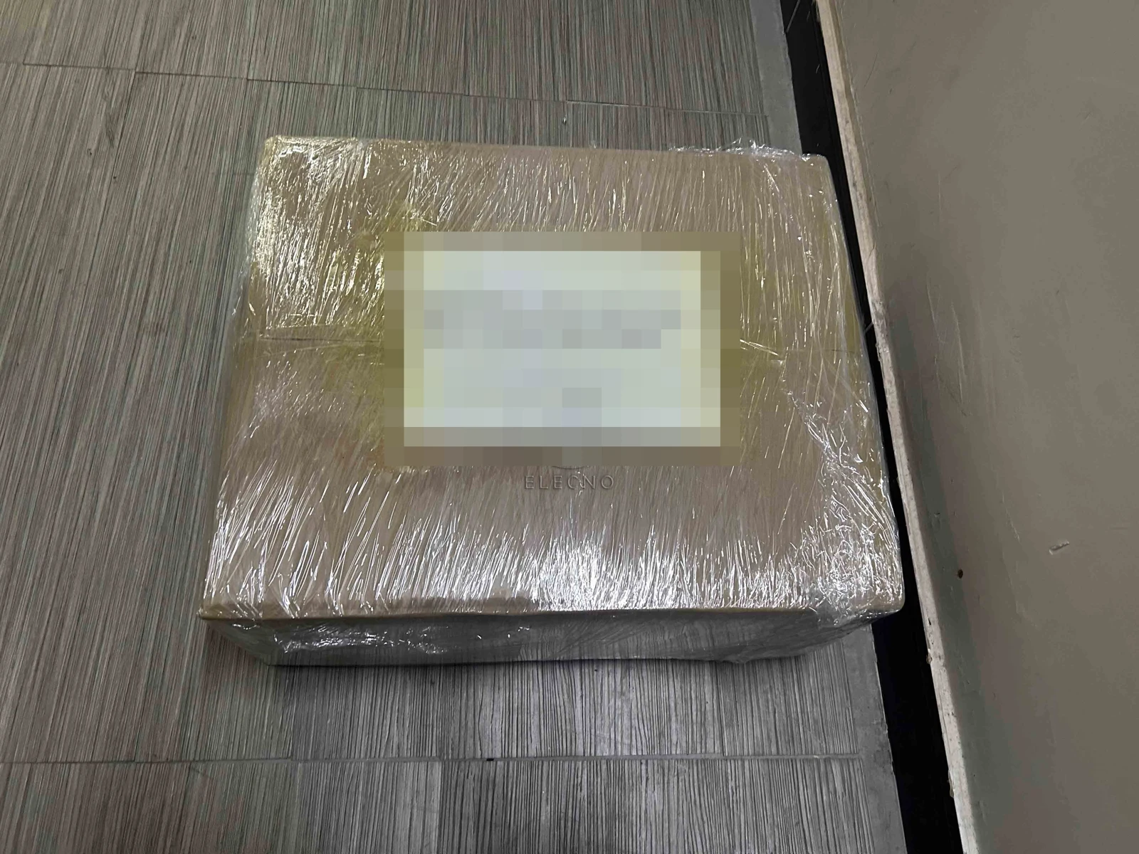 Protected wrapped shipping case for Ghana battery order with customer details obscured