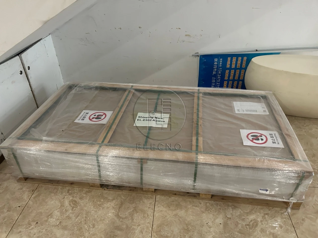 Closed wooden battery case wrapped and strapped for the Ghana shipment