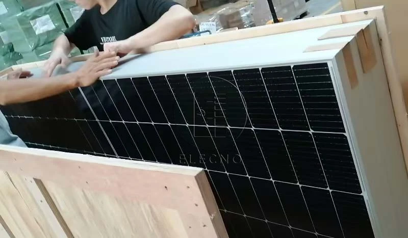 Solar panels arranged inside protective wooden crate for Ghana shipment