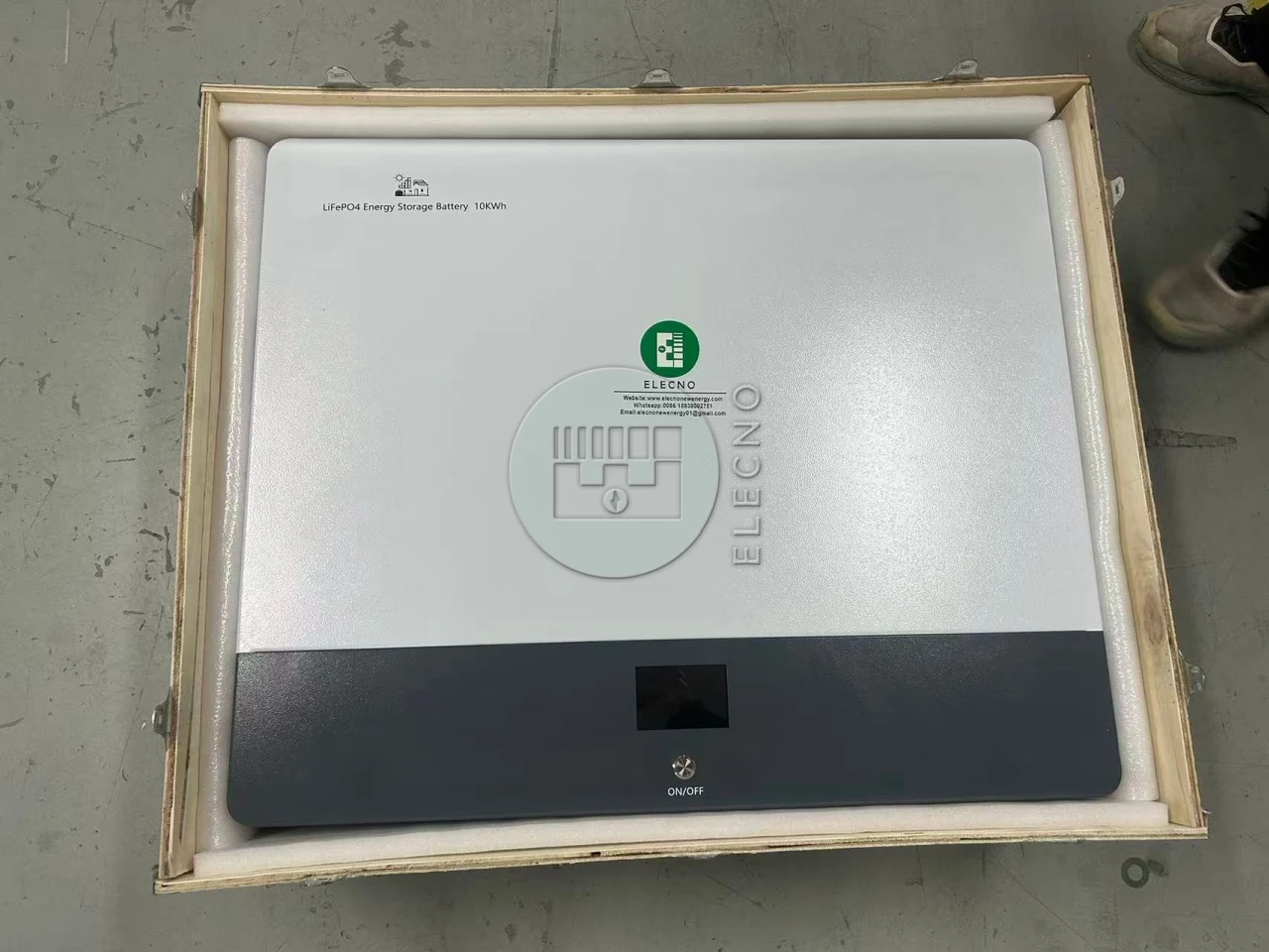 ELECNO wall-mounted battery protected inside an open wooden case for Ghana