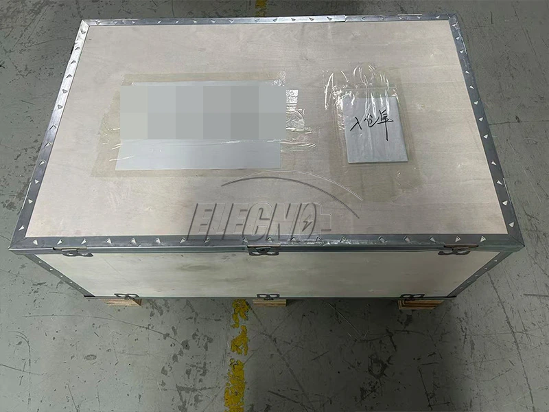 Protective shipping crate on a pallet with customer identification obscured