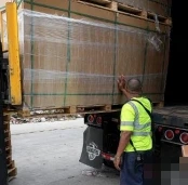ESS cargo at a truck with the license plate obscured