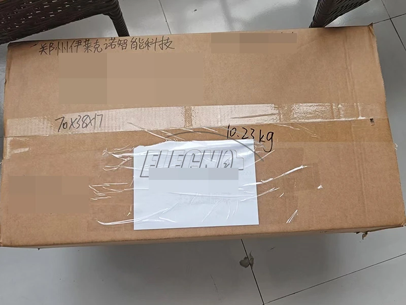 Horizontal view of the taped shipping carton with customer and internal identification obscured
