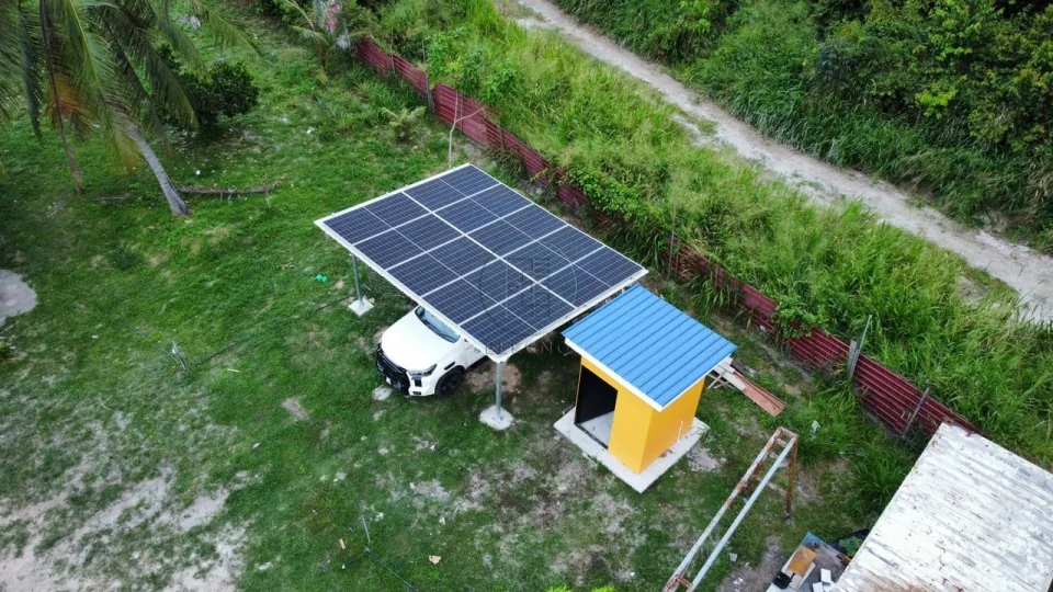 Aerial view of solar panels and farm buildings at the Malaysia solar storage project