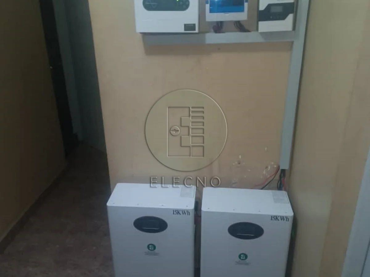 Wall-mounted inverter and dual battery system at a Nigeria customer site
